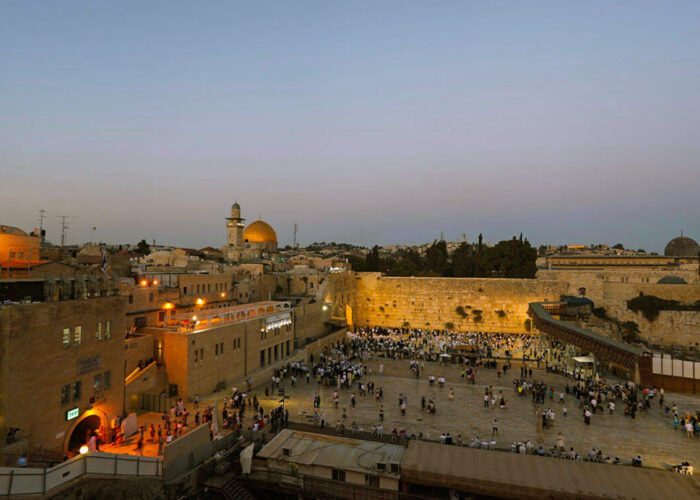 Wailing Wall Jewish prayers in Jerusalem Old City sunset